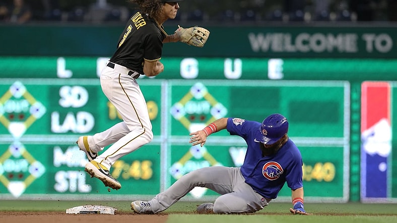Sep 28, 2021; Pittsburgh, Pennsylvania, USA;  Pittsburgh Pirates second baseman Cole Tucker (3) avoids the slide of Chicago Cubs right fielder Nick Martini (62) after throwing to first base to complete a double pay during the second inning at PNC Park. Mandatory Credit: Charles LeClaire-USA TODAY Sports