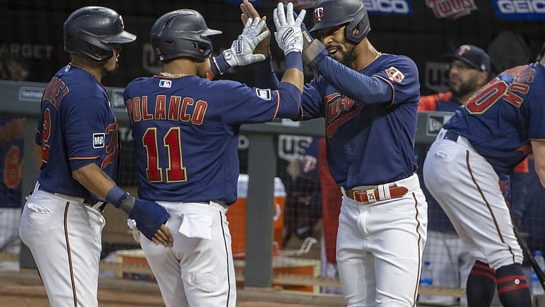 Sep 29, 2021; Minneapolis, Minnesota, USA; Minnesota Twins designated hitter Jorge Polanco (11) celebrates with center fielder Byron Buxton (25) after hitting a three run home run in the first inning against the Detroit Tigers at Target Field. Mandatory Credit: Jesse Johnson-USA TODAY Sports