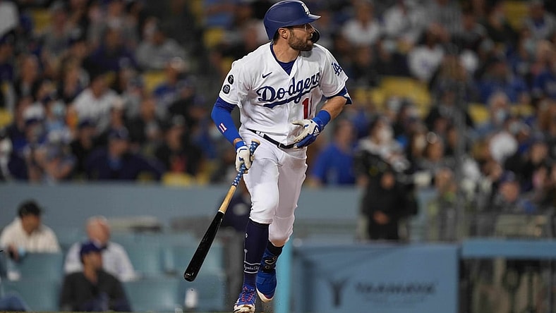 Sep 29, 2021; Los Angeles, California, USA; Los Angeles Dodgers left fielder AJ Pollock (11) watches his two-run home run in the first inning against the San Diego Padres at Dodger Stadium. Mandatory Credit: Kirby Lee-USA TODAY Sports