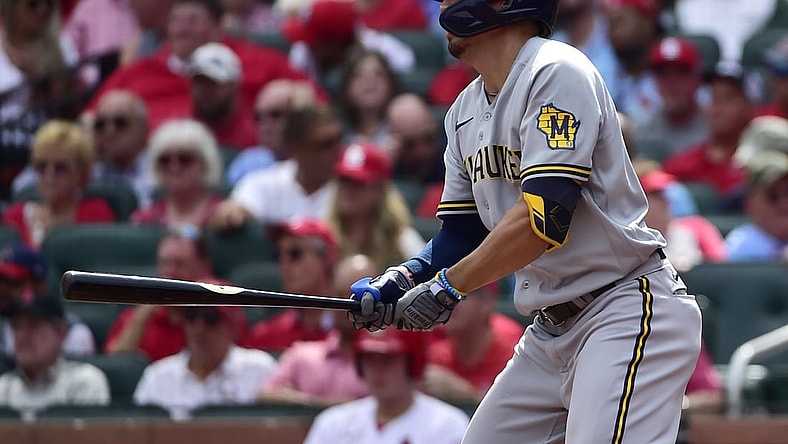 Sep 30, 2021; St. Louis, Missouri, USA;  Milwaukee Brewers right fielder Tyrone Taylor (15) hits a single during the fourth inning against the St. Louis Cardinals at Busch Stadium. Mandatory Credit: Jeff Curry-USA TODAY Sports