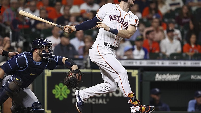 Sep 30, 2021; Houston, Texas, USA; Houston Astros right fielder Kyle Tucker (30) hits a double during the second inning against the Tampa Bay Rays at Minute Maid Park. Mandatory Credit: Troy Taormina-USA TODAY Sports