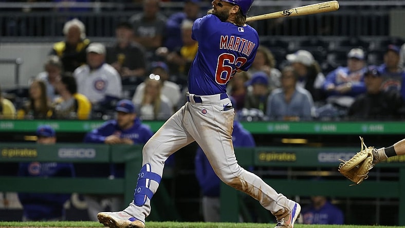 Sep 30, 2021; Pittsburgh, Pennsylvania, USA; Chicago Cubs right fielder Nick Martini (62) singles against the Pittsburgh Pirates during the fifth inning at PNC Park. Mandatory Credit: Charles LeClaire-USA TODAY Sports