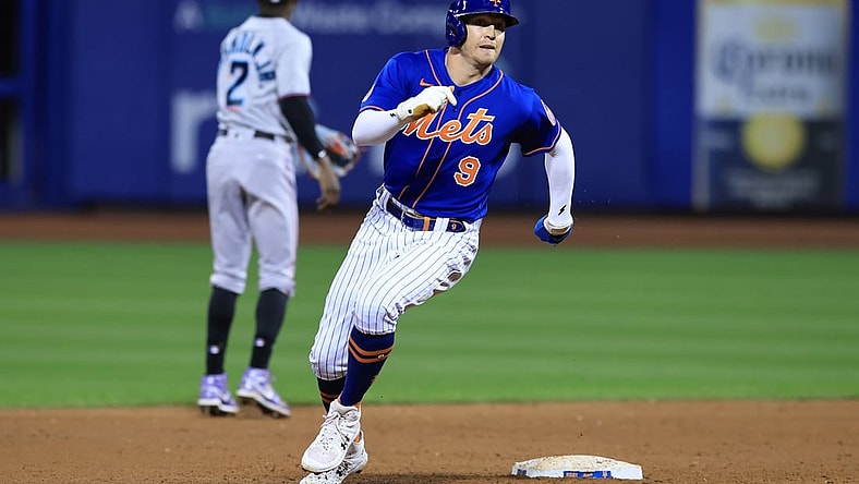 Sep 30, 2021; New York City, New York, USA; New York Mets center fielder Brandon Nimmo (9) rounds second base during an RBI single by right fielder Michael Conforto (not pictured) during the third inning against the Miami Marlins at Citi Field. Mandatory Credit: Vincent Carchietta-USA TODAY Sports