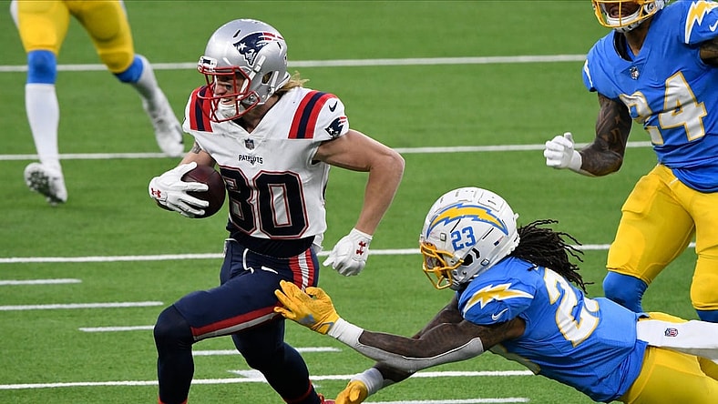 Dec 6, 2020; Inglewood, California, USA; New England Patriots wide receiver Gunner Olszewski (80) runs past Los Angeles Chargers strong safety Rayshawn Jenkins (23) in the fourth quarter at SoFi Stadium. Mandatory Credit: Robert Hanashiro-USA TODAY Sports