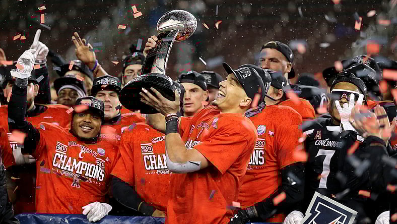 Cincinnati Bearcats quarterback Desmond Ridder (9) raises the championship trophy following the American Athletic Conference championship football game against the Tulsa Golden Hurricane, Saturday, Dec. 19, 2020, at Nippert Stadium in Cincinnati. The Cincinnati Bearcats won, 27-24.

Aac Championship Tulsa Golden Hurricane At Cincinnati Bearcats Football Dec 19
