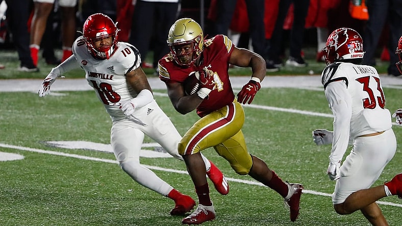Nov 28, 2020; Chestnut Hill, Massachusetts, USA; Boston College Eagles running back Pat Garwo III (24) runs against the Louisville Cardinals during the second half at Alumni Stadium. Mandatory Credit: Winslow Townson-USA TODAY Sports