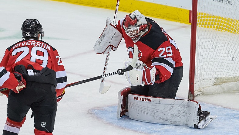 Apr 11, 2021; Newark, New Jersey, USA; New Jersey Devils goaltender Mackenzie Blackwood (29) makes a save in front of defenseman Damon Severson (28) during the first period against the Pittsburgh Penguins at Prudential Center. Mandatory Credit: Vincent Carchietta-USA TODAY Sports