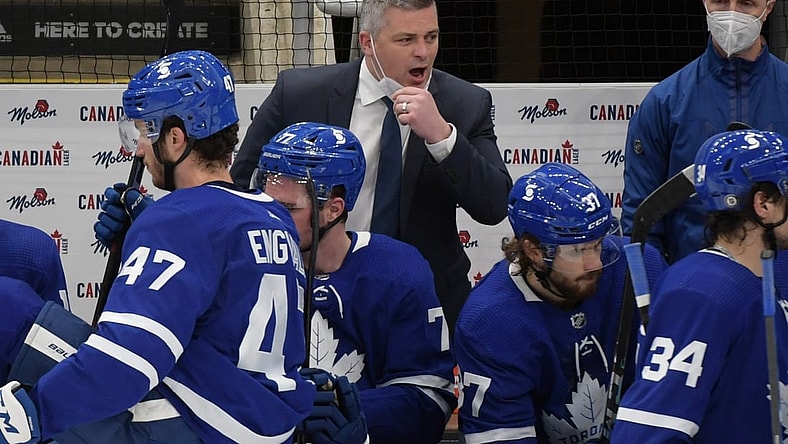 Apr 29, 2021; Toronto, Ontario, CAN;  Toronto Maple Leafs head coach Sheldon Keefe speaks to his players in the third period against the Vancouver Canucks at Scotiabank Arena. Mandatory Credit: Dan Hamilton-USA TODAY Sports