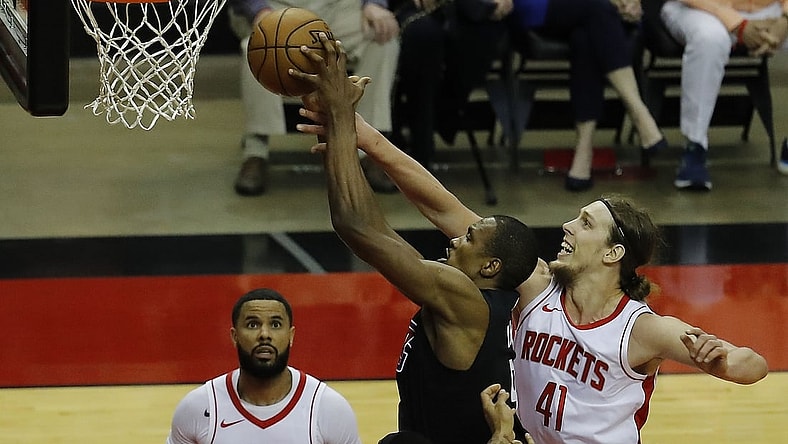 May 14, 2021; Houston, Texas, USA; LA Clippers center Serge Ibaka (9) drives to the basket as Houston Rockets forward Kelly Olynyk (41) defends during the first quarter at Toyota Center. Mandatory Credit:  Bob Levey/Pool Photo-USA TODAY Sports