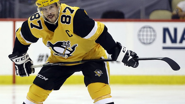May 24, 2021; Pittsburgh, Pennsylvania, USA;  Pittsburgh Penguins center Sidney Crosby (87) prepares to take the opening tac-off of the first overtime period against the New York Islanders in game five of the first round of the 2021 Stanley Cup Playoffs at PPG Paints Arena. New York won 3-2 in double overtime. Mandatory Credit: Charles LeClaire-USA TODAY Sports