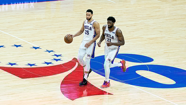 Jun 20, 2021; Philadelphia, Pennsylvania, USA; Philadelphia 76ers center Joel Embiid (21) and guard Ben Simmons (25) in action against the Atlanta Hawks during the second quarter of game seven of the second round of the 2021 NBA Playoffs at Wells Fargo Center. Mandatory Credit: Bill Streicher-USA TODAY Sports