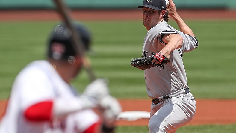 Jun 27, 2021; Boston, Massachusetts, USA; New York Yankees starting pitcher Gerrit Cole (45) throws a pitch during the first inning against the Boston Red Sox at Fenway Park. Mandatory Credit: Paul Rutherford-USA TODAY Sports