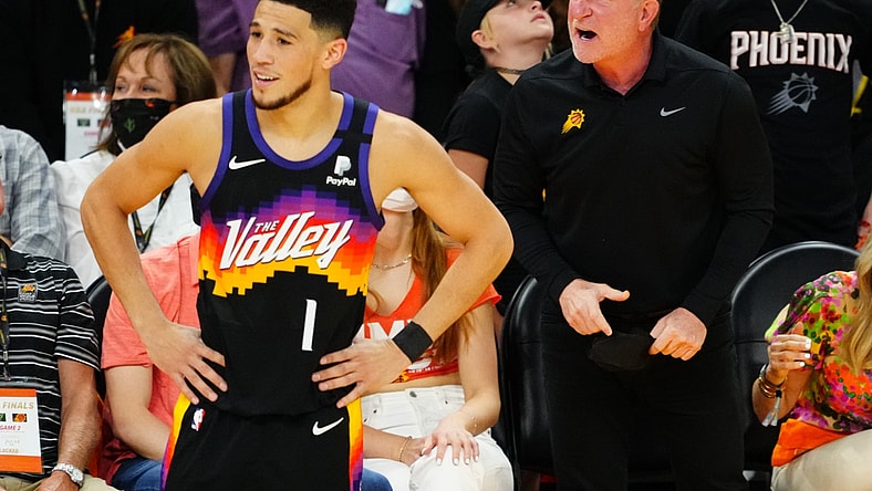 Jul 8, 2021; Phoenix, Arizona, USA; Phoenix Suns owner Robert Sarver reacts alongside guard Devin Booker (1) against the Milwaukee Bucks in game two of the 2021 NBA Finals at Phoenix Suns Arena. Mandatory Credit: Mark J. Rebilas-USA TODAY Sports