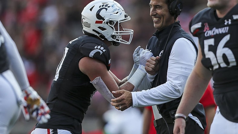 Sep 11, 2021; Cincinnati, Ohio, USA; Cincinnati Bearcats tight end Josh Whyle (81) celebrates after a touchdown with head coach Luke Fickell in the second half against the Murray State Racers at Nippert Stadium. Mandatory Credit: Katie Stratman-USA TODAY Sports