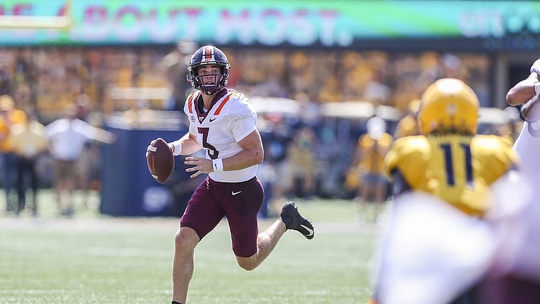Sep 18, 2021; Morgantown, West Virginia, USA; Virginia Tech Hokies quarterback Braxton Burmeister (3) runs out of the pocket during the second quarter against the West Virginia Mountaineers at Mountaineer Field at Milan Puskar Stadium. Mandatory Credit: Ben Queen-USA TODAY Sports