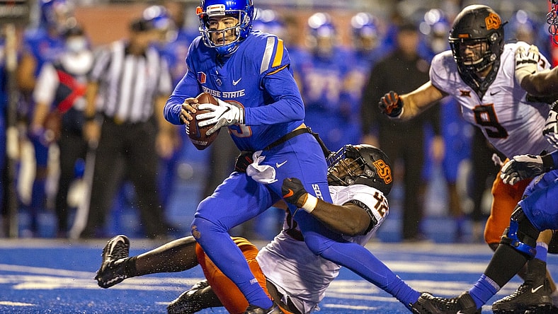 Sep 18, 2021; Boise, Idaho, USA; Boise State Broncos quarterback Hank Bachmeier (19) is sacked by Oklahoma State Cowboys defensive tackle Jayden Jernigan (42) during the second half at Albertsons Stadium. Oklahoma State won 21-20. Mandatory Credit: Brian Losness-USA TODAY Sports