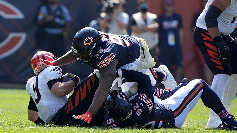 Sep 19, 2021; Chicago, Illinois, USA; Chicago Bears outside linebacker Khalil Mack (52) and defensive end Akiem Hicks (96) sack Cincinnati Bengals quarterback Joe Burrow (9) during the second half at Soldier Field. Mandatory Credit: Mike Dinovo-USA TODAY Sports