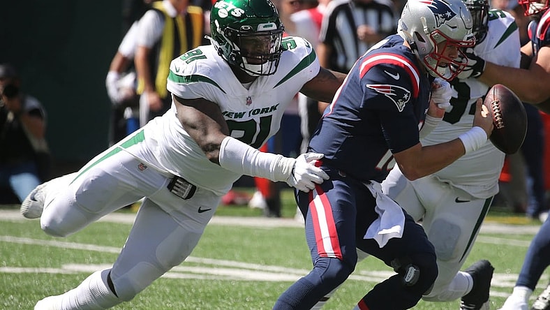 John Franklin-Myers of the Jets strips Patriots quarterback Mac Jones of the ball as the New England Patriots played the New York Jets at MetLife Stadium in East Rutherford, New Jersey, on Sept. 19, 2021.

The New England Patriots Came To Play The Ny Jets At Metlife Stadium In East Rutherford Nj On September 19 2021