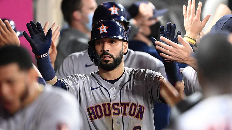 Sep 20, 2021; Anaheim, California, USA; Houston Astros second baseman Marwin Gonzalez (9) is congratulated in the dugout after hitting a grand slam home run against the Los Angeles Angels in the ninth inning at Angel Stadium. Mandatory Credit: Jayne Kamin-Oncea-USA TODAY Sports
