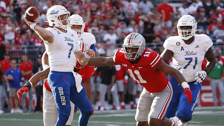 Ohio State defensive end Tyreke Smith pressures Tulsa quarterback Davis Brin.
