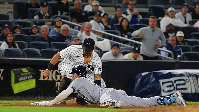 Oct 1, 2021; Bronx, New York, USA; Tampa Bay Rays center fielder Kevin Kiermaier (39) slides safely into third base with a triple against the New York Yankees during the fifth inning at Yankee Stadium. Mandatory Credit: Andy Marlin-USA TODAY Sports