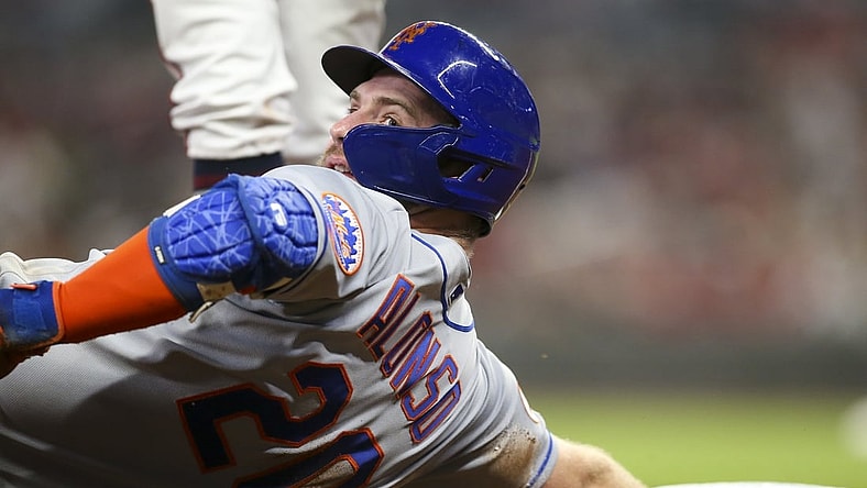 Oct 1, 2021; Atlanta, Georgia, USA; New York Mets first baseman Pete Alonso (20) reacts after sliding safely into third past the tag of Atlanta Braves third baseman Ehire Adrianza (not pictured) in the fourth inning at Truist Park. Mandatory Credit: Brett Davis-USA TODAY Sports