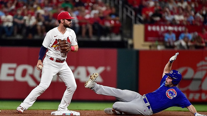 Oct 1, 2021; St. Louis, Missouri, USA;  Chicago Cubs starting pitcher Cory Abbott (15) slides in at after he was forced out by St. Louis Cardinals shortstop Paul DeJong (11) during the third inning at Busch Stadium. Mandatory Credit: Jeff Curry-USA TODAY Sports