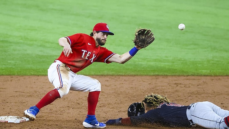 Oct 1, 2021; Arlington, Texas, USA;  Cleveland Indians third baseman Jose Ramirez (11) steals second base ahead of the tag by Texas Rangers second baseman Nick Solak (15) during the third inning at Globe Life Field. Mandatory Credit: Kevin Jairaj-USA TODAY Sports