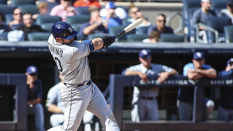 Oct 2, 2021; Bronx, New York, USA; Tampa Bay Rays catcher Mike Zunino (10) hits a solo home run in the third inning against the New York Yankees at Yankee Stadium. Mandatory Credit: Wendell Cruz-USA TODAY Sports
