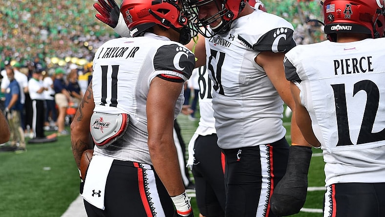 Oct 2, 2021; South Bend, Indiana, USA; Cincinnati Bearcats tight end Leonard Taylor (11) celebrates after a touchdown in the second quarter against the Notre Dame Fighting Irish at Notre Dame Stadium. Mandatory Credit: Matt Cashore-USA TODAY Sports