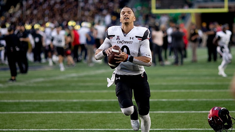 Cincinnati Bearcats quarterback Desmond Ridder (9) runs to throw the ball to Cincinnati Bearcats fans after the NCAA football game on Saturday, Oct. 2, 2021, at Notre Dame Stadium in South Bend, Ind. Cincinnati Bearcats defeated Notre Dame Fighting Irish 24-13.

Cincinnati Bearcats At Notre Dame Fighting Irish 222
