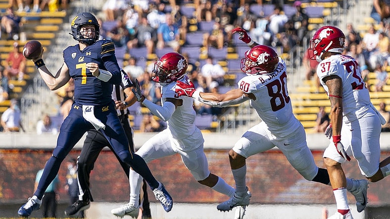 October 2, 2021; Berkeley, California, USA; California Golden Bears quarterback Chase Garbers (7) passes the football against Washington State Cougars defensive back Derrick Langford (5) and defensive end Brennan Jackson (80) and linebacker Justus Rogers (37) during the second quarter at FTX Field at California Memorial Stadium. Mandatory Credit: Kyle Terada-USA TODAY Sports