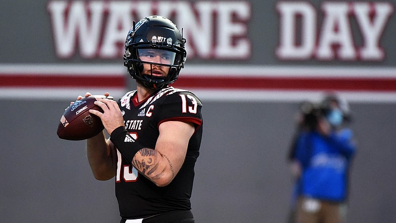 Oct 2, 2021; Raleigh, North Carolina, USA; North Carolina State Wolfpack quarterback Devin Leary (13) drops back to pass against the Louisiana Tech Bulldogs during the first half at Carter-Finley Stadium. Mandatory Credit: Rob Kinnan-USA TODAY Sports