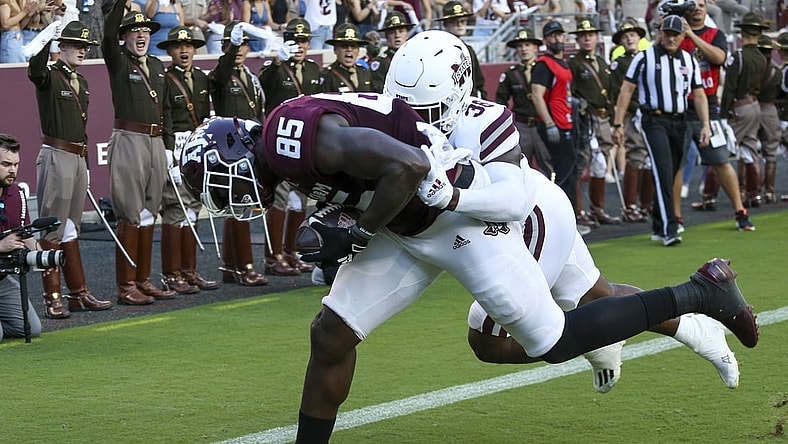 Oct 2, 2021; College Station, Texas, USA; Texas A&M Aggies tight end Jalen Wydermyer (85) catches a touchdown pass against Mississippi State Bulldogs safety Fred Peters (38)  in the first quarter at Kyle Field. Mandatory Credit: Thomas Shea-USA TODAY Sports
