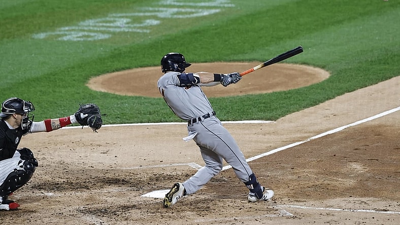 Oct 2, 2021; Chicago, Illinois, USA; Detroit Tigers left fielder Robbie Grossman (8) singles against the Chicago White Sox during the fourth inning at Guaranteed Rate Field. Mandatory Credit: Kamil Krzaczynski-USA TODAY Sports