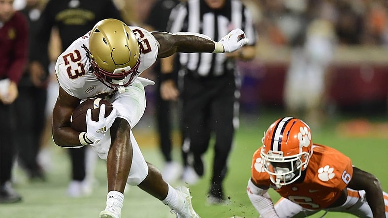 Oct 2, 2021; Clemson, South Carolina, USA; Boston College Eagles running back Travis Levy (23) is pushed out of bounds by Clemson Tigers cornerback Sheridan Jones (6) during the second quarter at Memorial Stadium. Mandatory Credit: Adam Hagy-USA TODAY Sports
