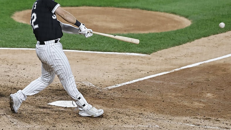 Oct 2, 2021; Chicago, Illinois, USA; Chicago White Sox first baseman Gavin Sheets (32) hits an RBI-single against the Detroit Tigers during the seventh inning at Guaranteed Rate Field. Mandatory Credit: Kamil Krzaczynski-USA TODAY Sports
