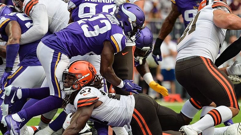 Oct 3, 2021; Minneapolis, Minnesota, USA; Cleveland Browns running back Kareem Hunt (27) reaches for the endzone to score a touchdown as Minnesota Vikings free safety Xavier Woods (23) defends during the second quarter at U.S. Bank Stadium. Mandatory Credit: Jeffrey Becker-USA TODAY Sports