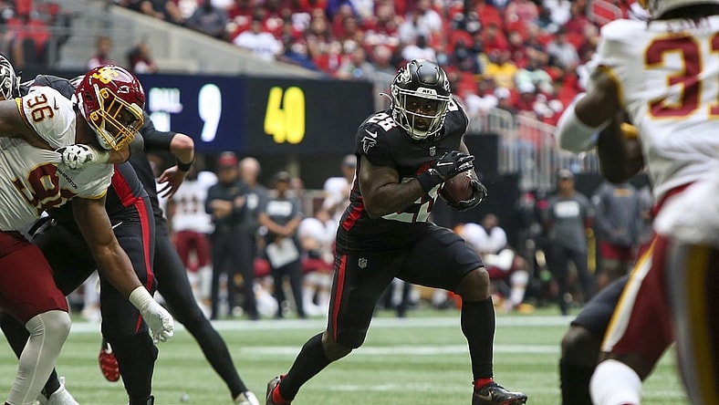 Oct 3, 2021; Atlanta, Georgia, USA; Atlanta Falcons running back Mike Davis (28) runs the ball against the Washington Football Team in the first quarter at Mercedes-Benz Stadium. Mandatory Credit: Brett Davis-USA TODAY Sports