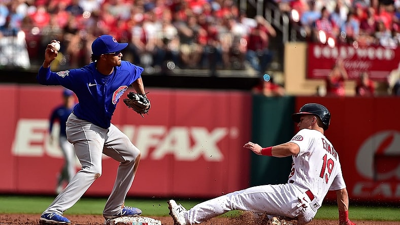 Oct 3, 2021; St. Louis, Missouri, USA;  Chicago Cubs shortstop Sergio Alcantara (51) turns a double play as St. Louis Cardinals second baseman Tommy Edman (19) slides during the third inning at Busch Stadium. Mandatory Credit: Jeff Curry-USA TODAY Sports