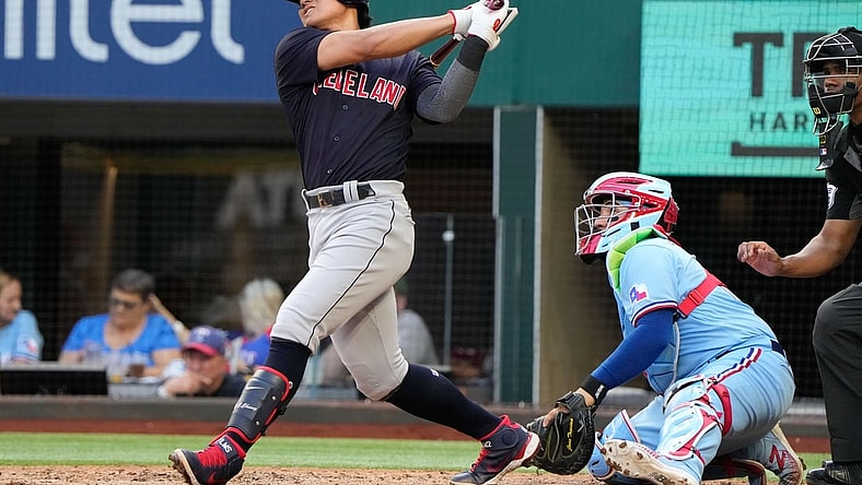 Oct 3, 2021; Arlington, Texas, USA; Cleveland Indians first baseman Yu Chang (2) follows though on his two-run home run against the Texas Rangers during the fifth inning at Globe Life Field. Mandatory Credit: Jim Cowsert-USA TODAY Sports
