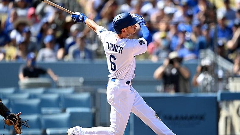 Oct 3, 2021; Los Angeles, California, USA;  Los Angeles Dodgers shortstop Trea Turner (6) hits a grand slam home run in the fifth inning of the game against the Milwaukee Brewers Dodger Stadium. Mandatory Credit: Jayne Kamin-Oncea-USA TODAY Sports