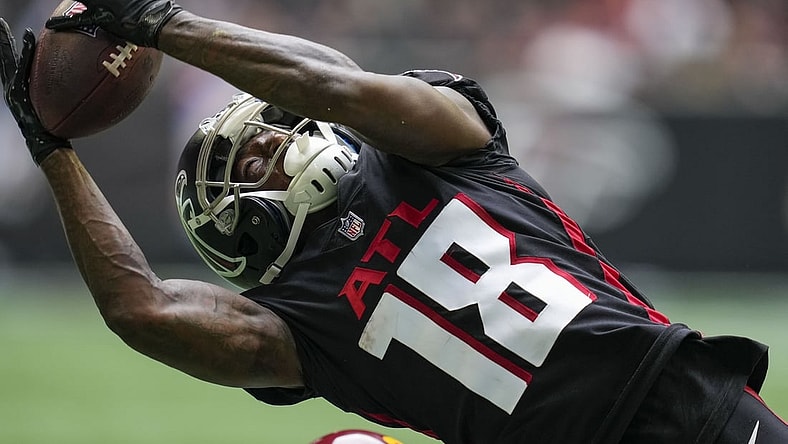 Oct 3, 2021; Atlanta, Georgia, USA; Atlanta Falcons wide receiver Calvin Ridley (18) tries to catch a pass against the Washington Football Team during the second half at Mercedes-Benz Stadium. Mandatory Credit: Dale Zanine-USA TODAY Sports