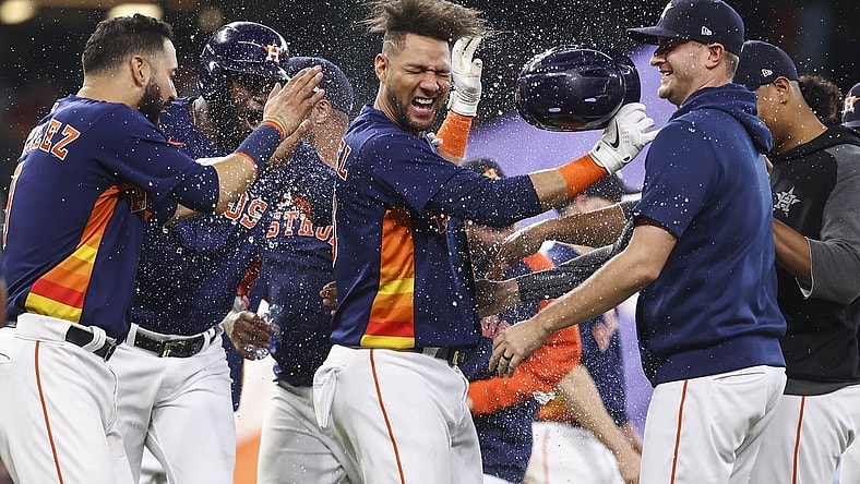Oct 3, 2021; Houston, Texas, USA; Houston Astros first baseman Yuli Gurriel (10) celebrates with teammates after hitting a game-winning RBI single during the ninth inning against the Oakland Athletics at Minute Maid Park. Mandatory Credit: Troy Taormina-USA TODAY Sports