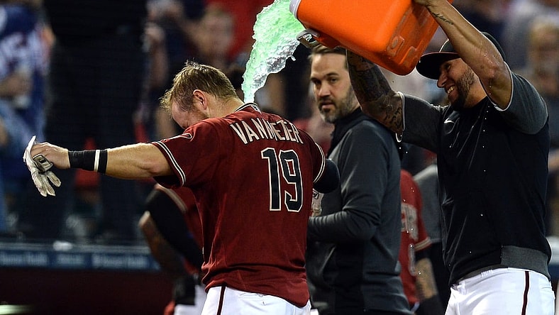 Oct 3, 2021; Phoenix, Arizona, USA; Arizona Diamondbacks left fielder David Peralta douses Arizona Diamondbacks second baseman Josh VanMeter (19) after a walk-off home run against the Colorado Rockies during the ninth inning at Chase Field. Mandatory Credit: Joe Camporeale-USA TODAY Sports