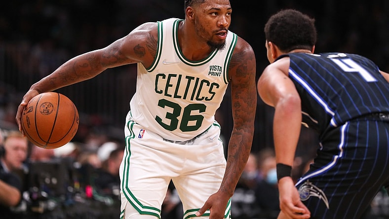 Oct 4, 2021; Boston, Massachusetts, USA; Boston Celtics guard Marcus Smart (36) controls the ball defended by Orlando Magic guard Jalen Suggs (4) during the second half at TD Garden. Mandatory Credit: Paul Rutherford-USA TODAY Sports
