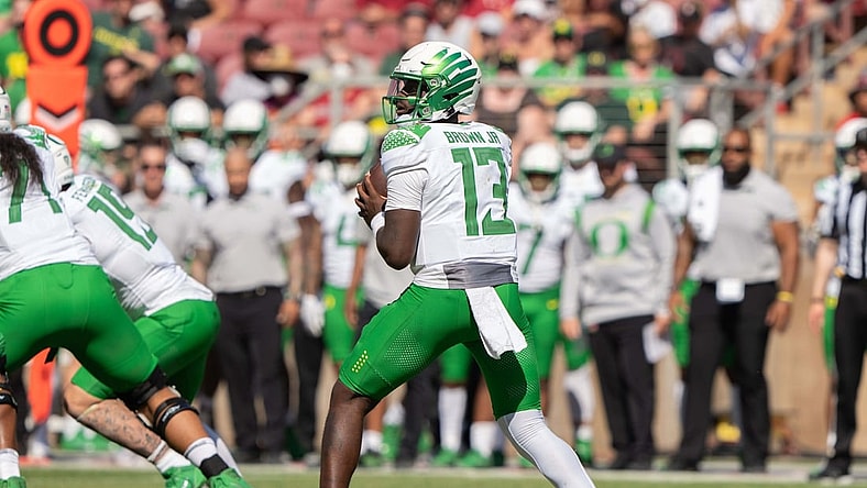 Oct 2, 2021; Stanford, California, USA;  Oregon Ducks quarterback Anthony Brown (13) prepares to throw the football during the second quarter against the Stanford Cardinal at Stanford Stadium. Mandatory Credit: Stan Szeto-USA TODAY Sports
