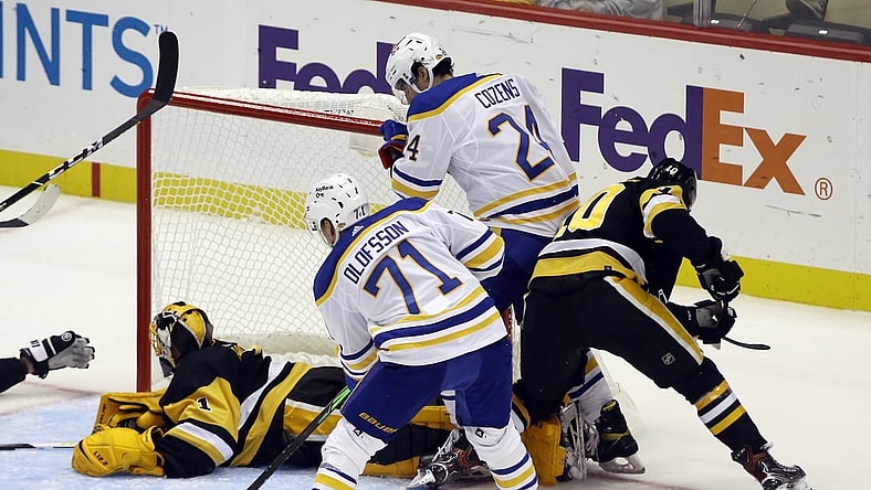 Oct 5, 2021; Pittsburgh, Pennsylvania, USA; Buffalo Sabres right wing Victor Olofsson (71) scores a goal against Pittsburgh Penguins goaltender Casey DeSmith (1) during the second period at PPG Paints Arena. Mandatory Credit: Charles LeClaire-USA TODAY Sports
