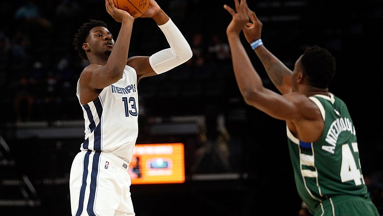 Oct 5, 2021; Memphis, Tennessee, USA; Memphis Grizzles forward Jaren Jackson Jr. (13) shoots for three during the first half against the Milwaukee Bucks at FedExForum. Mandatory Credit: Petre Thomas-USA TODAY Sports