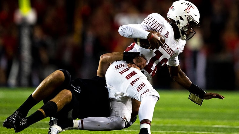 Cincinnati Bearcats linebacker Wilson Huber (2) sacks Temple Owls quarterback D'Wan Mathis (18) in the first half of the NCAA football game between the Cincinnati Bearcats and the Temple Owls on Friday, Oct. 8, 2021, at Nippert Stadium in Cincinnati.

Temple Owls At Cincinnati Bearcats